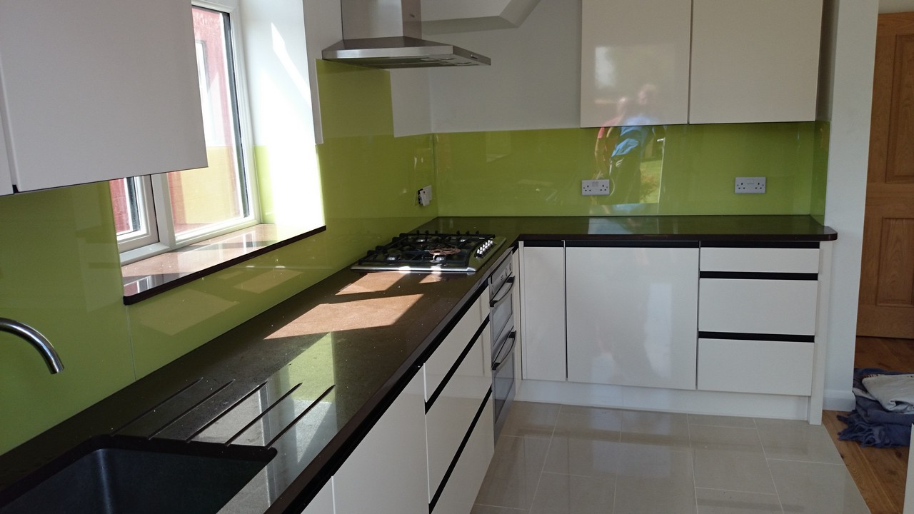 Lime green glass kitchen splashback installed by Golders Green glaziers